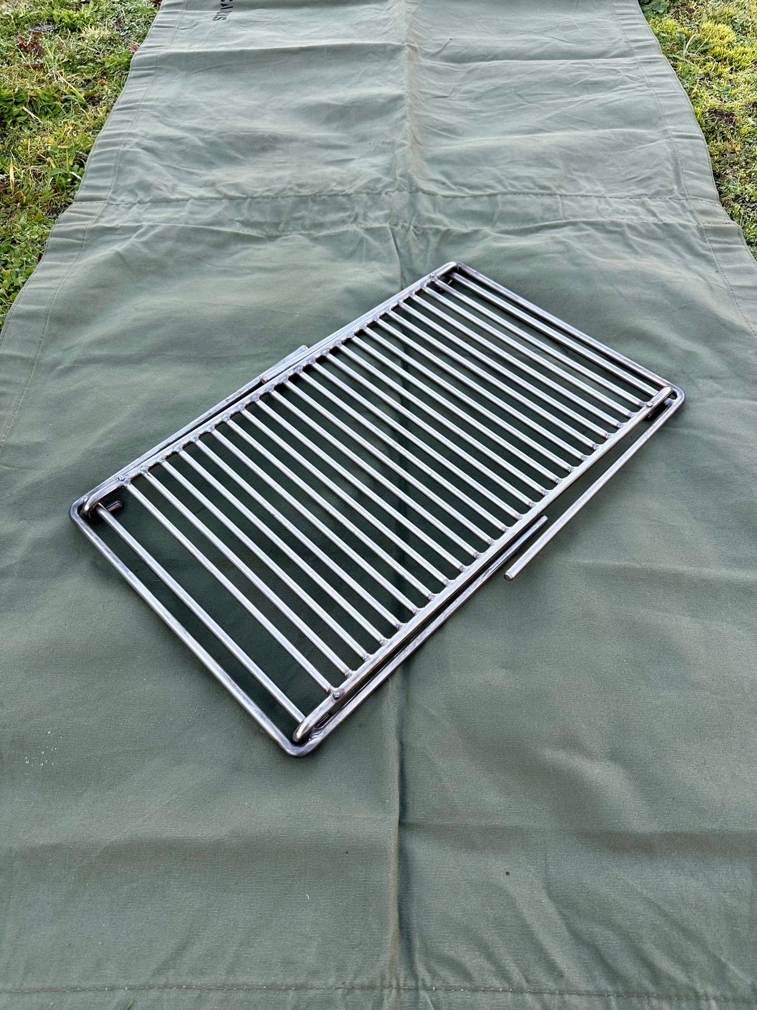 Folding Bushcraft and Camping BBQ Grill Can Cook upto 10 plus people. Compact and Portable.