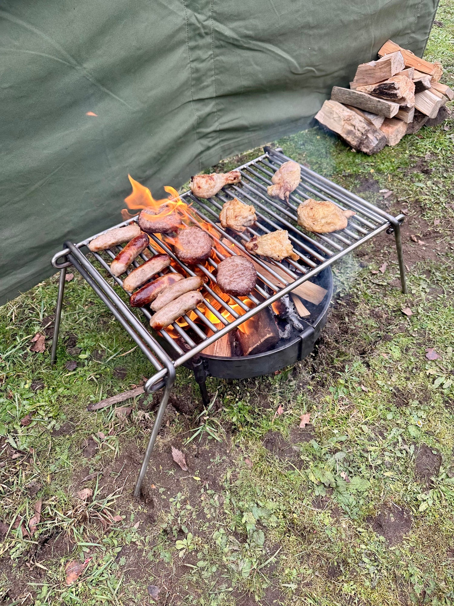 Folding Bushcraft and Camping BBQ Grill Can Cook upto 10 plus people. Compact and Portable.